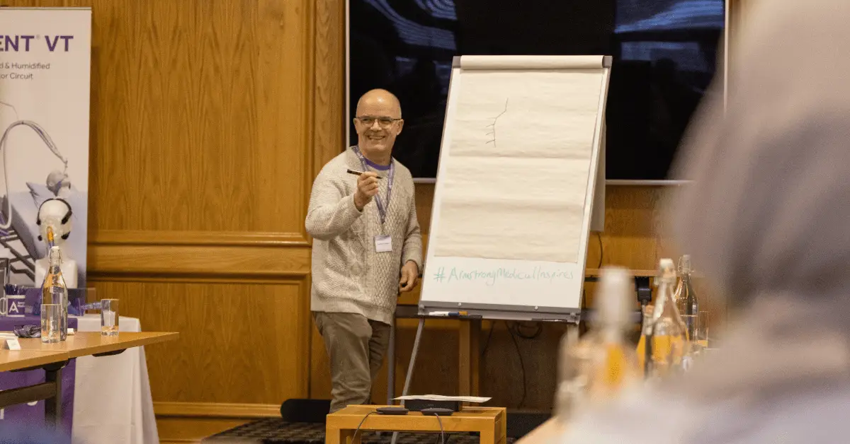 Critical Care Practitioner presenting a whiteboard of a