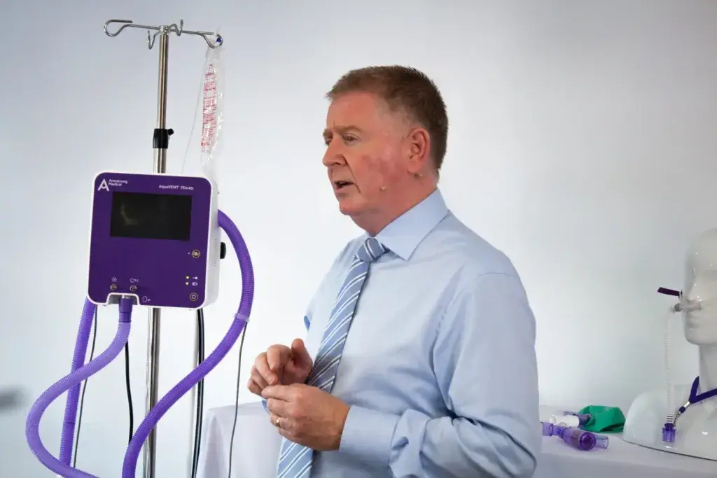 Image of an educator providing training for the AquaVENTFD140i. Armstrong Medical provides respiratory care training and education resources.