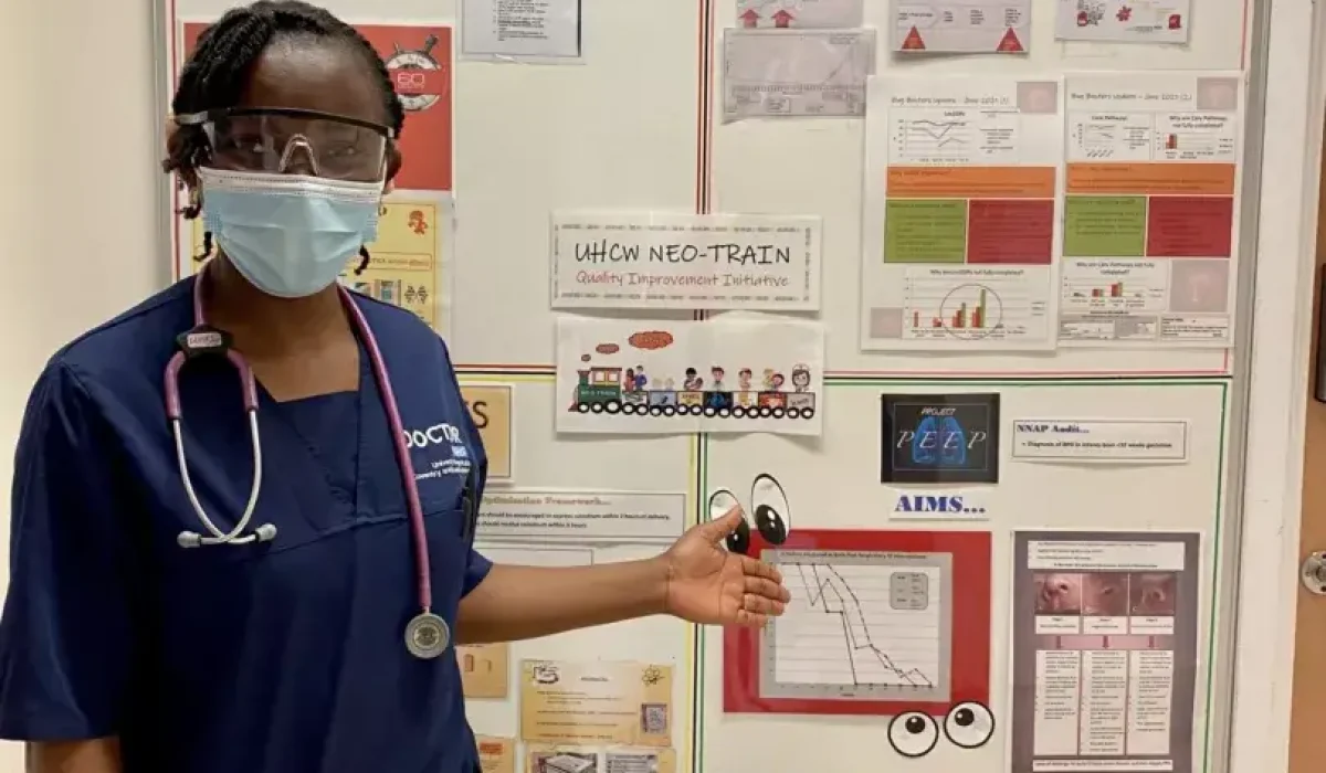 A medical professional infront of breathign circuit diagrams and information